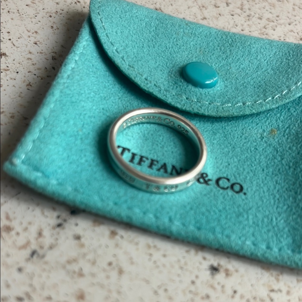 Tiffany & Co. Sterling Silver Thin Band Ring on Tiffany Blue Pouch